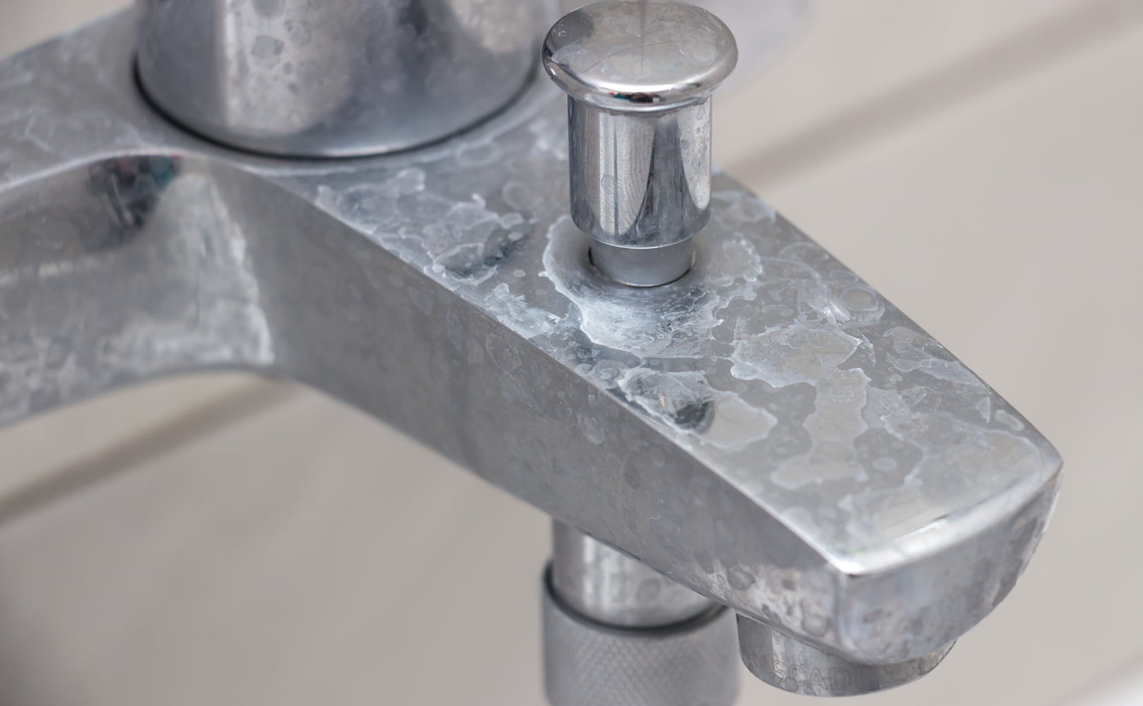 hard water scale on bathtub tap