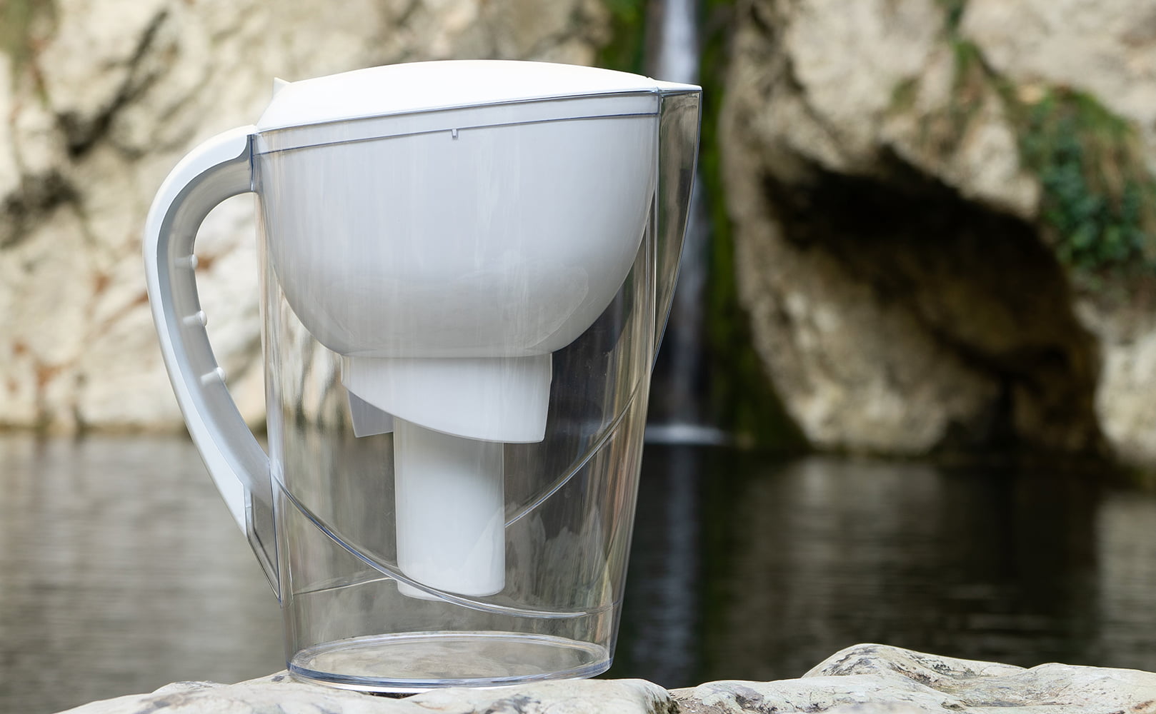 water filter pitcher with waterfall in background