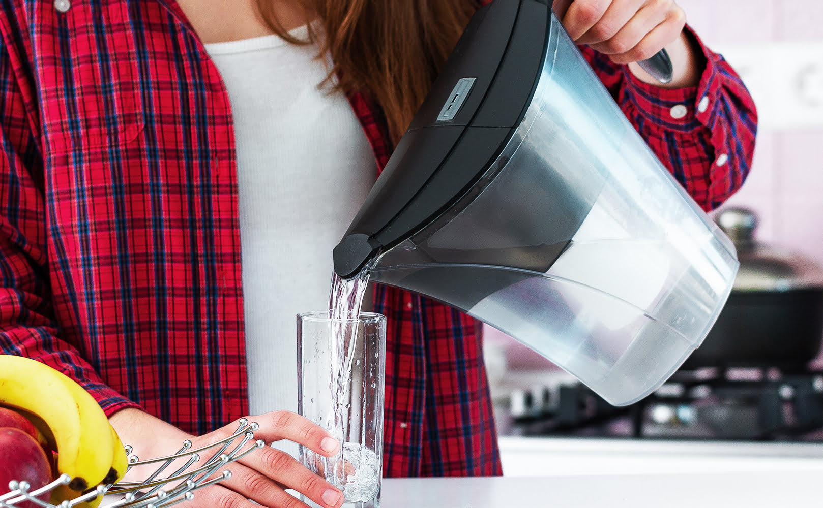 woman with water filter pitcher