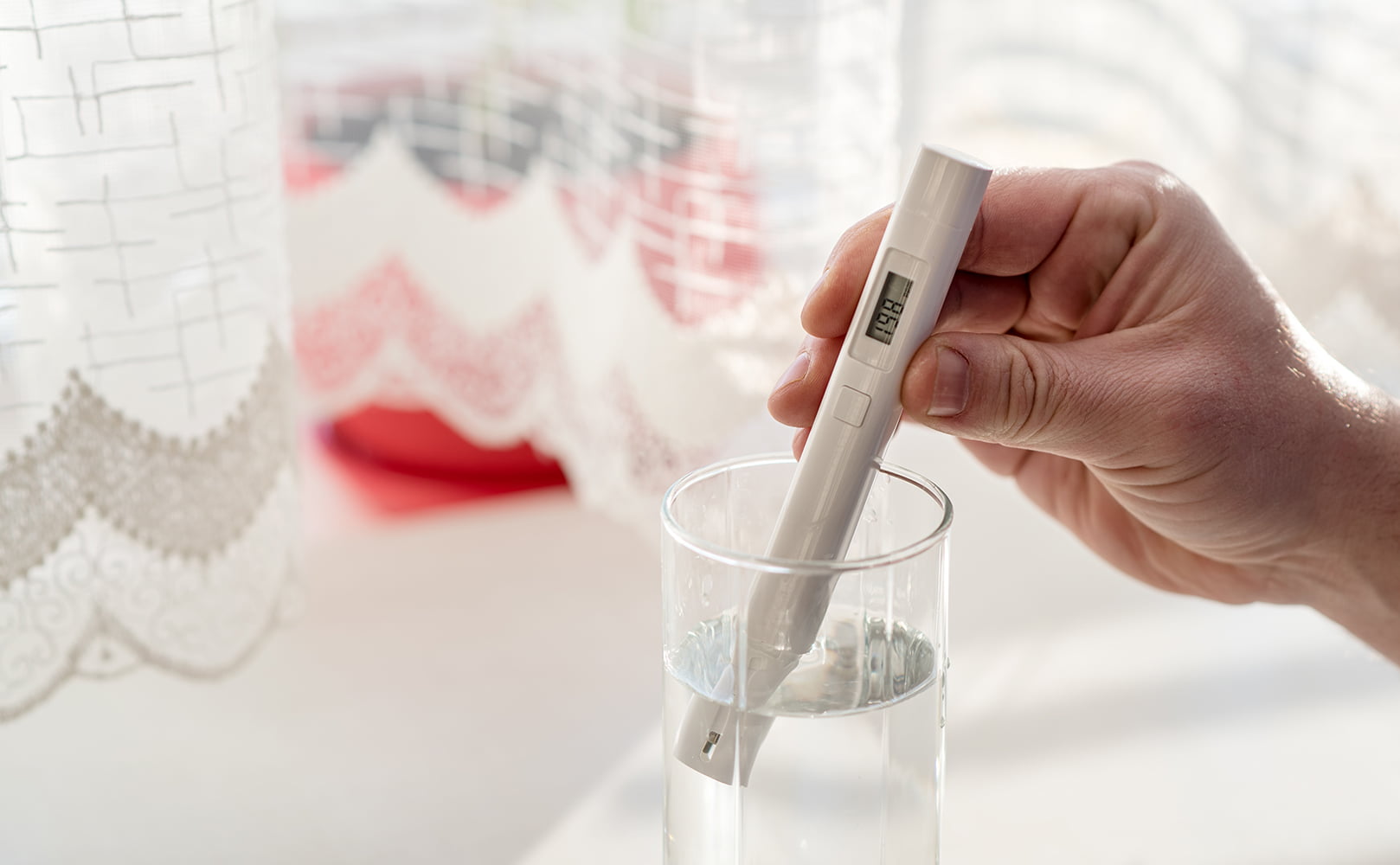 tds meter in glass of water